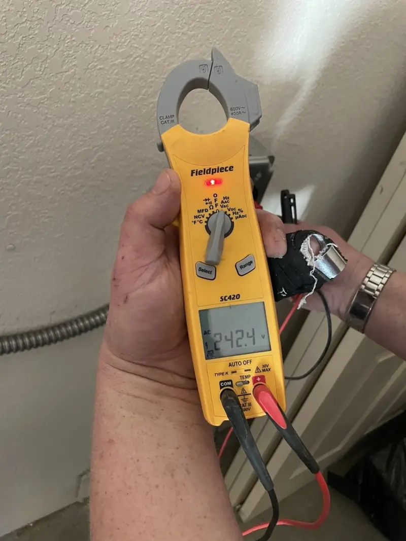 Voltage testing with clamp meter during Outlet Installation in Marlow Heights